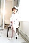 Asian cutie Miina Minamoto wears a hot nurses uniform with sexy stockings and plays with herself
