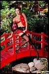 Enchanting oriental hottie Sammy Stone in black stockings does some modeling on the bridge
