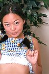 Asian first timer Amy undressing to model naked in pigtails on chair