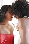 Ebony and Asian lesbians Misty Stone and Angelina Chung tongue kissing