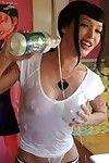 Busty Asian babe Masuimi Max drinks and pours milk on her boobs and strips.