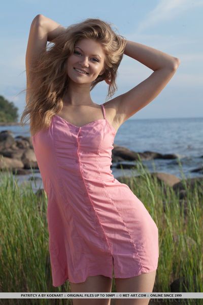Beach babe Patritcy A revealing tiny amateur breasts outdoors for glamour photos