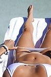 Breasty babe Brandi Keen to shows her milf apple bottoms in strings in outdoor pool