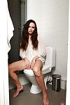 Wiry brunette doll amplifying wet and hairy uterus in washroom