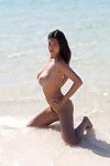 Biggest busted dark hair vixen striptease off her pink panties on the beach