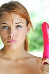 Dazzling redhead strokes her cramped pussy with a really stiff toy