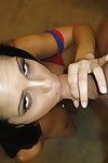 Dark-haired cougar Diamond Kitty gives blowjob and strokes cock with hands