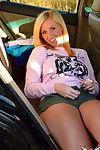Hilarious and brave blonde babe is taking off her panties in the car outdoors