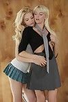 Skinny blonde Emma X Art and another schoolgirl in uniform bare their tiny tits