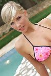 Leggy blonde Tiffany Rousso takes off her pink bikini to show her big tits and pink hole outdoors