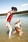Teen lesbian Sara J introduces new friend to girl on girl sex in water