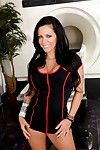 The busty brunette Jenna Presley looks great in lingerie and high red boots