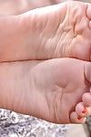 Chloue Lacourt and Niki Diamond are licking feet in a foot fetish vid