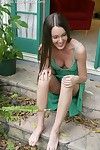 Cute brunette Erica Ellyson with perky boobs removes her green dress in the backyard
