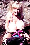 Bosomy older blonde beach bunny Busty Dusty playing with her wet fun bags