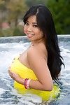 Oriental hottie Kya Tropic shows off sodden milk sacks and skinhead strapping gentile in outdoor jacuzzi