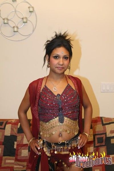 Ponytailed indian wench strips and shows her round boobies
