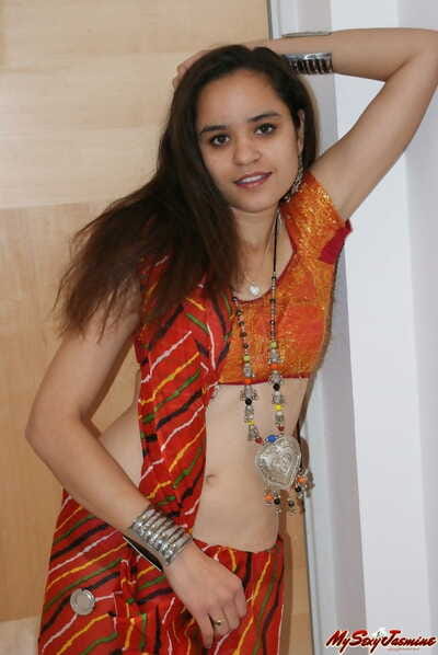Indian princess Jasime takes her habituated clothes together with poses nude