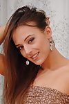 Gorgeous and naked solo teen Dominika is demonstrating their way sexy figure beside the room